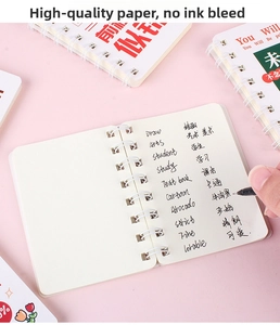Detail view of A7 mini spiral notebooks showing smooth paper and double-coil binding design
