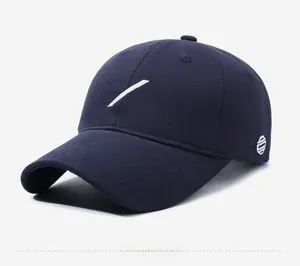 Detail view of navy blue cotton twill baseball cap featuring white striped embroidery