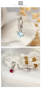 Macro detail of star-shaped zircon pendants on huggie earrings in three bright colors