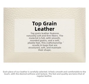 Macro shot of off-white top grain cowhide leather showing natural lychee texture