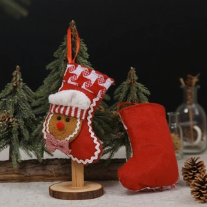 Christmas gingerbread man and red felt stockings holiday gift bags for festive decoration