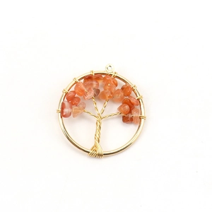 Detailed view of Tree of Life pendant with orange natural stone chips and gold wire