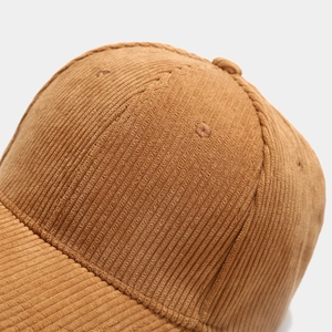 Caramel brown corduroy baseball cap featuring vintage ribbed texture and 6-panel structure