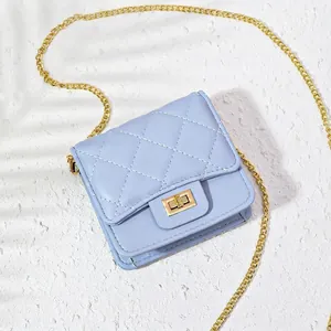 Elegant light blue quilted crossbody bag with a golden chain strap and rotary lock