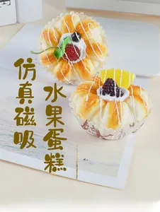 Macro shot of realistic fake cake fridge magnets with fruit toppings and cream texture