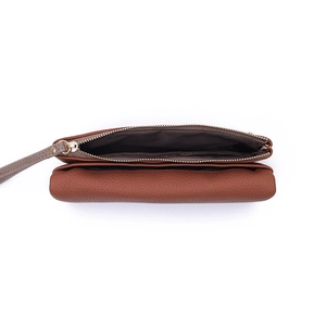Detail view of brown pebbled leather wallet with gold zipper and multi-compartment interior
