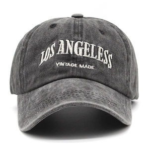 Close-up of vintage washed dark grey baseball cap with white embroidered LOS ANGELES text