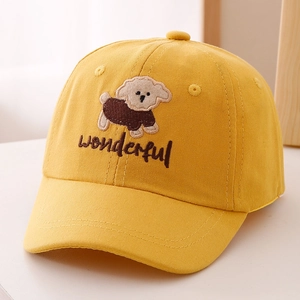 Close-up of cute dog embroidery and yellow cotton fabric on a child baseball cap