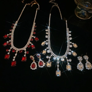 Detailed view of luxury square rhinestone pendant necklaces and teardrop earring sets