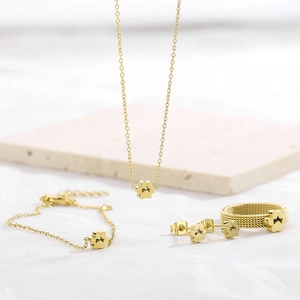 Elegant gold-tone jewelry set including cat paw pendant necklace, bracelet, ring, and studs