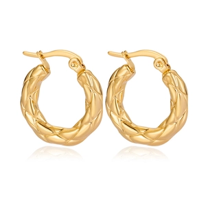 Minimalist golden stainless steel hoop earrings with quilted diamond texture on white background