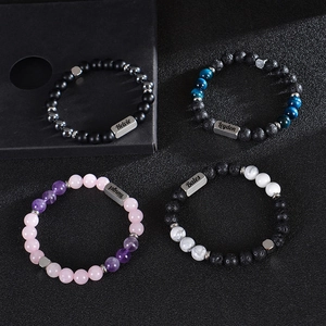 Custom engraved stainless steel name bar with natural lava and tiger eye beaded bracelets