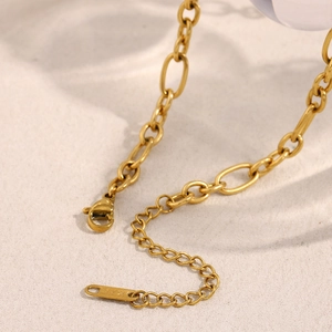 Macro detail of 18K gold plated stainless steel chain necklace with lobster clasp