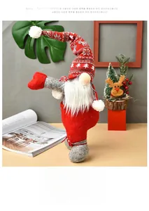 Close-up of a Christmas gnome curtain tie with red reindeer knit hat and white plush beard