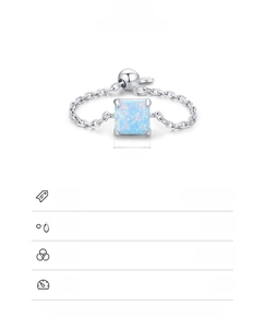 Macro detail of S925 sterling silver chain ring with 6x6mm square blue opal stone