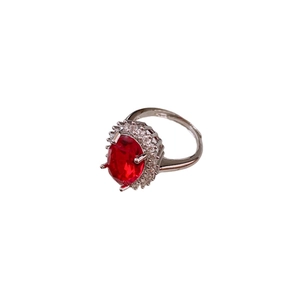 Vintage oval red gemstone ring with zircon flower accents on polished silver band