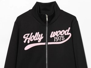 Close-up of black zip-up collar with pink Hollywood 1975 3D embroidery detail