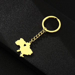 Detail of a gold stainless steel Ukraine map keychain with a heart-shaped cutout design