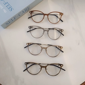 Vintage round cat-eye blue light blocking glasses in amber, grey, tea, and green colors