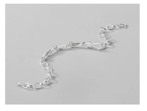 Macro shot of S925 sterling silver twisted cable chain bracelet with polished finish