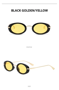 Detail view of Y2K oval metal sunglasses with black frames and yellow lenses