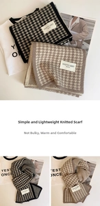 Close-up of soft houndstooth knitted scarf with Nice To Meet brand label detail