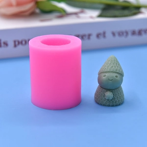 Detail of pink silicone mold with 3D snowman cake topper and strawberry textured finish
