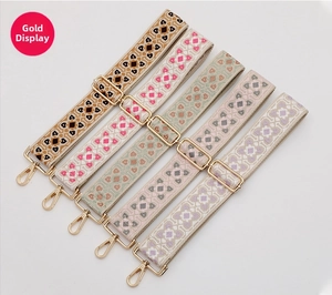 Collection of wide ethnic embroidery shoulder straps with gold hardware and floral patterns