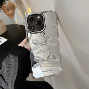 Detail of silver mirror phone case with 3D bow and elegant text engraving