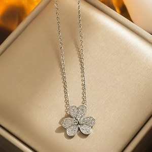 Elegant silver four-leaf clover necklace with sparkling crystals in a premium gift box