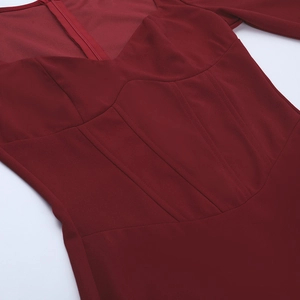 Detail of sweetheart neckline and corset-style boning on this slim burgundy dress