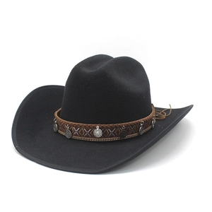 Detail of black felt cowboy hat featuring ethnic embroidery and silver coin pendants
