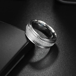 Polished stainless steel couple ring with frosted center band on black background