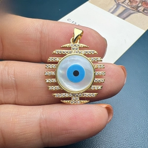 Golden shell evil eye pendant with sparkling white zircons for women jewelry DIY