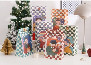 Retro Christmas gift bags with checkerboard patterns shown in a lifestyle holiday setting