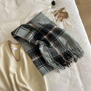 Soft blue plaid scarf with fringes paired with beige V-neck knitted sweater vest