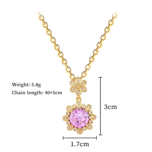 Detail of gold flower necklace with pink crystal center and clear stones including dimensions