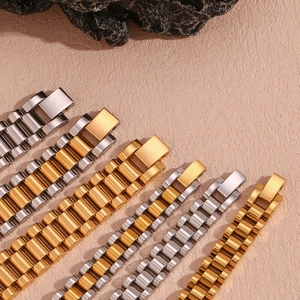 Detail of luxury 18K gold plated stainless steel watch band with classic link design