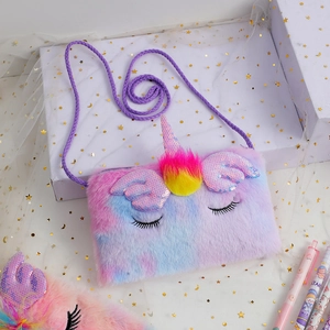 Detailed macro view of plush rainbow unicorn bag with sequins and embroidered eyes