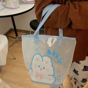 Détail du sac de plage transparent en PVC avec lapin mignon et poignées bleu ciel