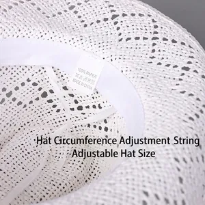Interior detail of white woven straw sun hat with adjustable inner strap and sweatband