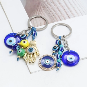 Hamsa hand evil eye keychain with blue beads and crystals on silver metal ring