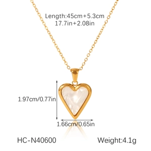 Detail of gold heart pendant necklace with white shell inlay and 45cm chain dimensions