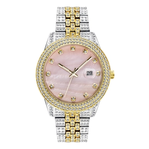 Close-up of diamond-set watch with pink mother-of-pearl dial and two-tone gold band