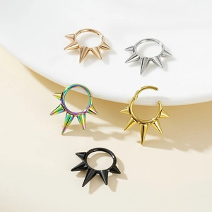 Detail of spiked nose rings in five colors including rose gold, silver, and gold