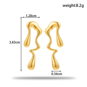 Minimalist liquid metal gold drop earrings featuring irregular wavy design 3.83cm long