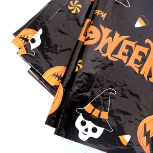 Detail of disposable Halloween tablecloth with spooky pumpkin and skull graphics