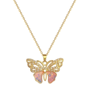 Elegant gold titanium necklace featuring a butterfly pendant with pink resin and crystals