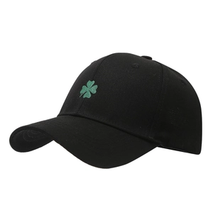 Classic black baseball cap with green lucky shamrock embroidery and structured crown