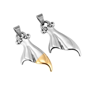 Macro detail of two minimalist titanium steel whale tail pendants in silver and gold finish